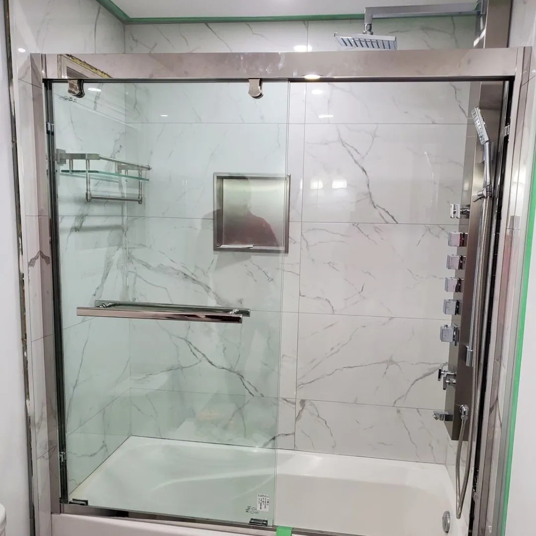 Renovated bathroom with arched mirrors and double undermount sinks in Bowmanville, Ontario